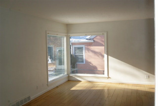 spare room with light hardwood / wood-style floors