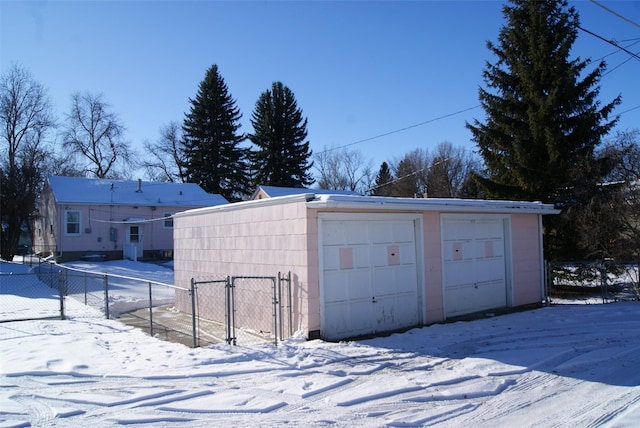 view of snow covered garage