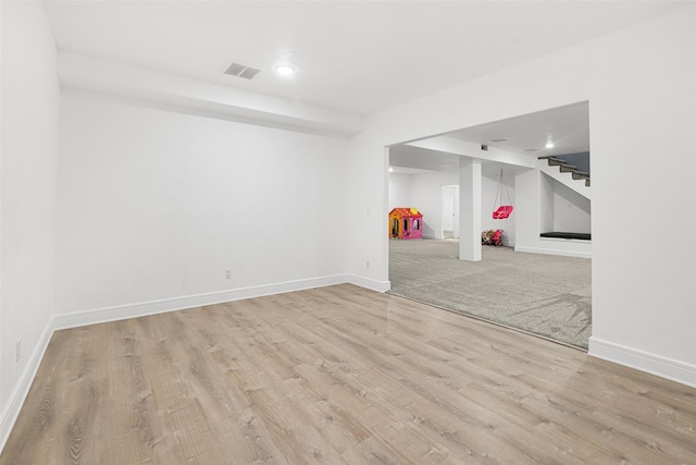 basement featuring light wood-type flooring