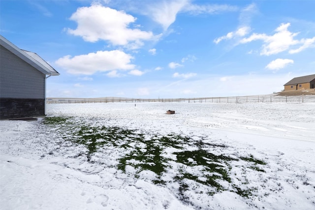 view of yard layered in snow