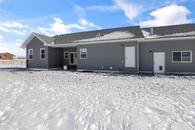 view of snow covered house