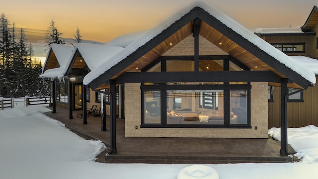 view of snow covered property entrance