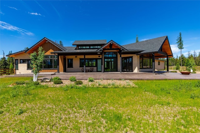 3900 Foothill Rd, Kalispell, MT 59901 - back of property with a patio area and a yard