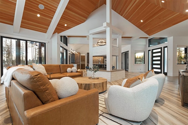3900 Foothill Rd, Kalispell, MT 59901 - living area featuring wood ceiling with exposed beams, healthy amount of natural light, high vaulted ceiling, light wood-style flooring, and recessed lighting