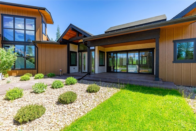 3900 Foothill Rd, Kalispell, MT 59901 - back of property with board and batten siding and a lawn