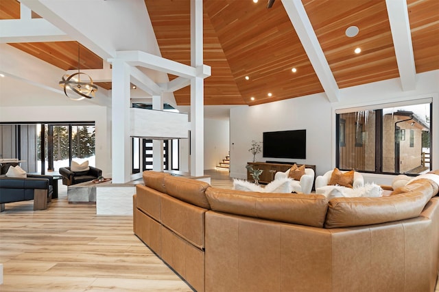 3900 Foothill Rd, Kalispell, MT 59901 - living room featuring wooden ceiling with exposed beams, high vaulted ceiling, light wood-style floors, recessed lighting, and a chandelier