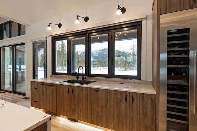 3900 Foothill Rd, Kalispell, MT 59901 - bar with a sink, wine cooler, and lofted ceiling