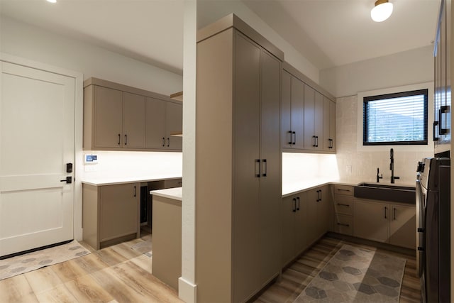 3900 Foothill Rd, Kalispell, MT 59901 - washroom featuring cabinet space and light wood finished floors