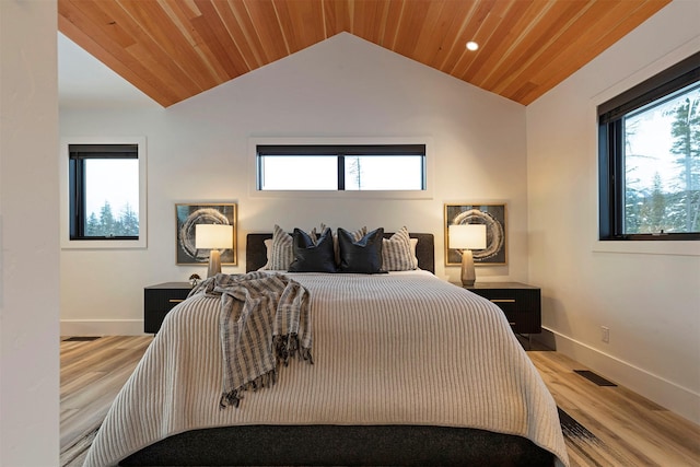 bedroom featuring wood ceiling, lofted ceiling, and light wood-type flooring