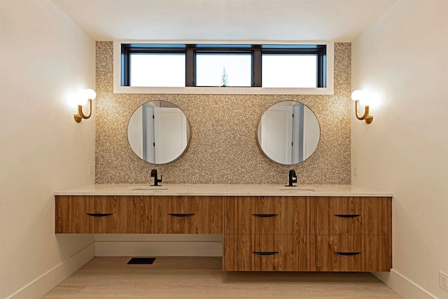 3900 Foothill Rd, Kalispell, MT 59901 - full bath featuring double vanity, decorative backsplash, and plenty of natural light