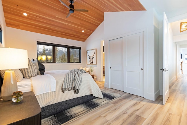 3900 Foothill Rd, Kalispell, MT 59901 - bedroom featuring lofted ceiling, light wood finished floors, wooden ceiling, recessed lighting, and a closet