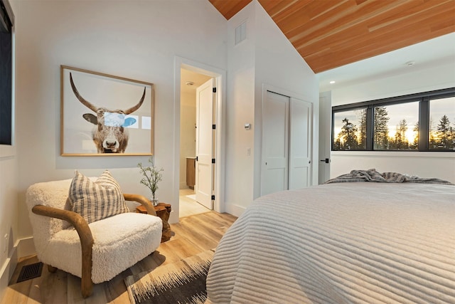 3900 Foothill Rd, Kalispell, MT 59901 - bedroom featuring vaulted ceiling, wood finished floors, wooden ceiling, baseboards, and a closet