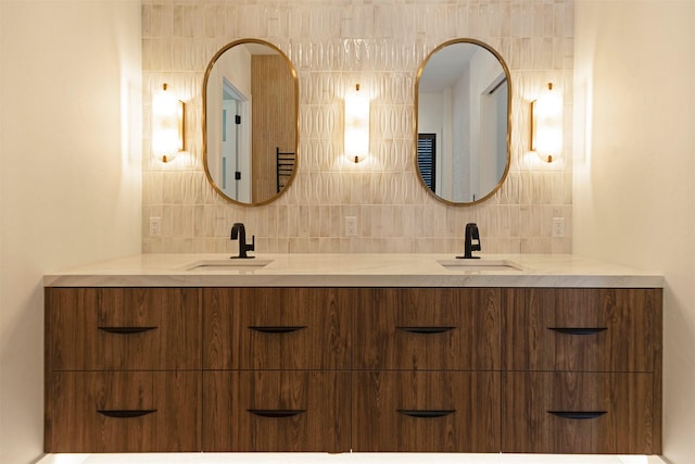 bathroom with vanity and decorative backsplash