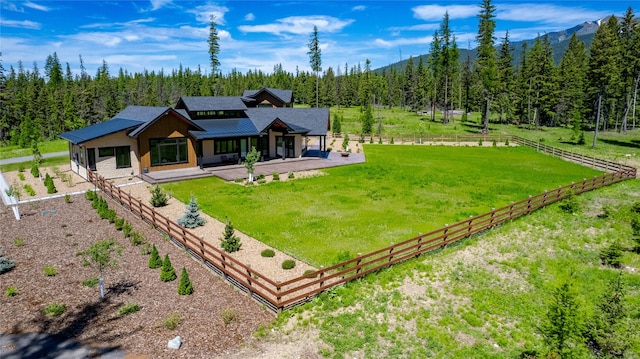 3900 Foothill Rd, Kalispell, MT 59901 - rear view of house featuring a view of trees