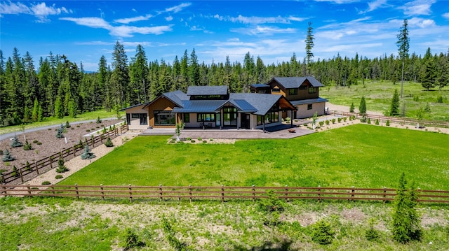 3900 Foothill Rd, Kalispell, MT 59901 - rear view of property with a patio and a forest view
