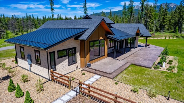 3900 Foothill Rd, Kalispell, MT 59901 - view of building exterior with a mountain view and a forest view