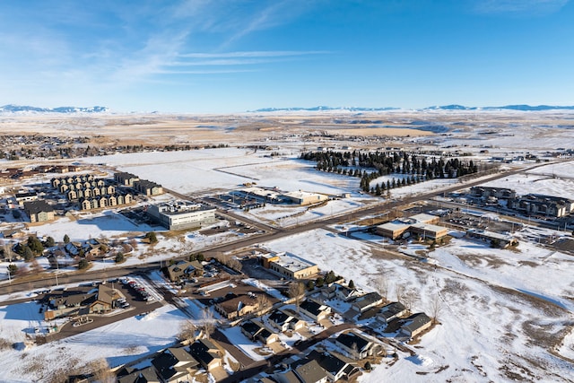 snowy aerial view with a mountain view