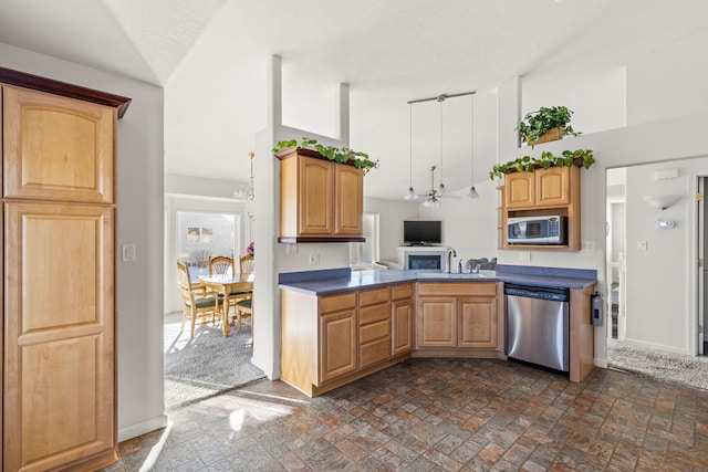 kitchen featuring built in microwave, lofted ceiling, dishwasher, and sink