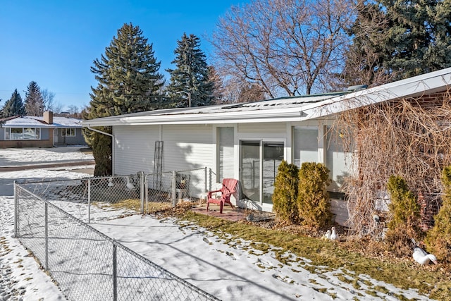 view of snow covered property