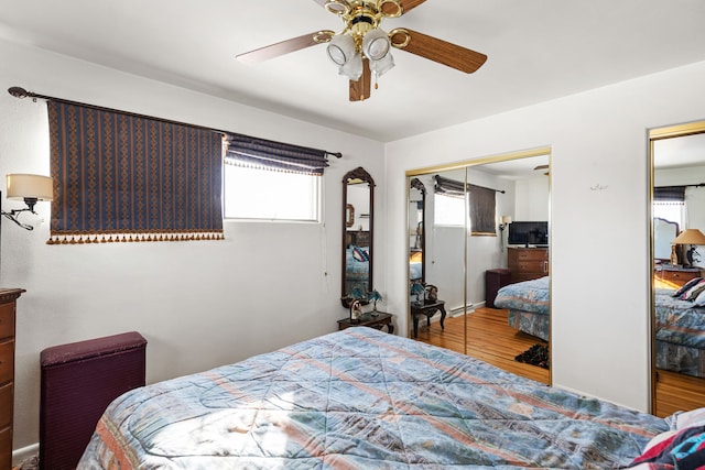 bedroom featuring ceiling fan and hardwood / wood-style floors