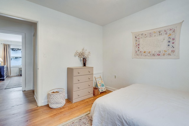 bedroom featuring wood-type flooring