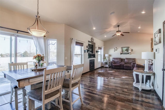 dining space featuring vaulted ceiling, beverage cooler, dark hardwood / wood-style floors, and ceiling fan