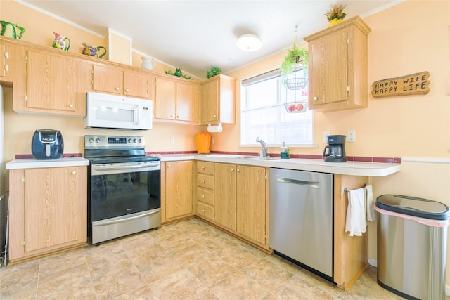 kitchen with sink, stainless steel appliances, ornamental molding, vaulted ceiling, and light brown cabinets