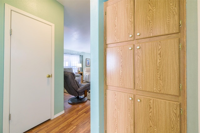 hallway with light wood-type flooring