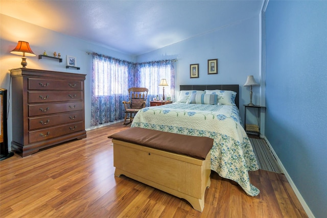 bedroom with wood-type flooring