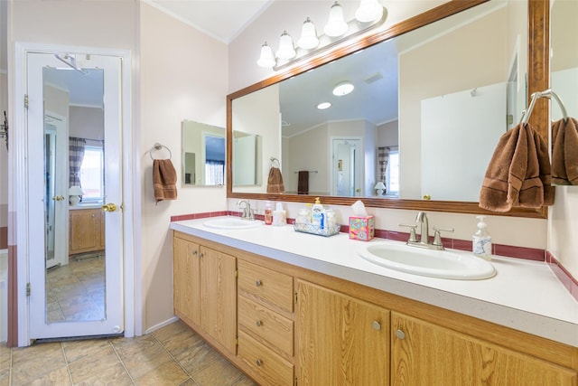 bathroom featuring vanity and crown molding