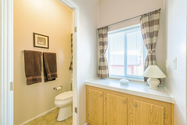 bathroom featuring tile patterned floors and toilet