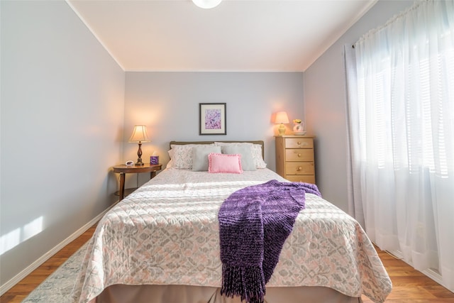 bedroom with light wood-type flooring