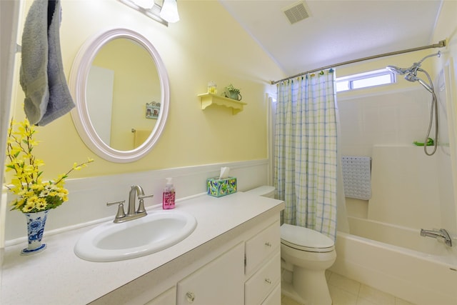 full bathroom with tile patterned floors, vanity, toilet, and shower / bath combo with shower curtain