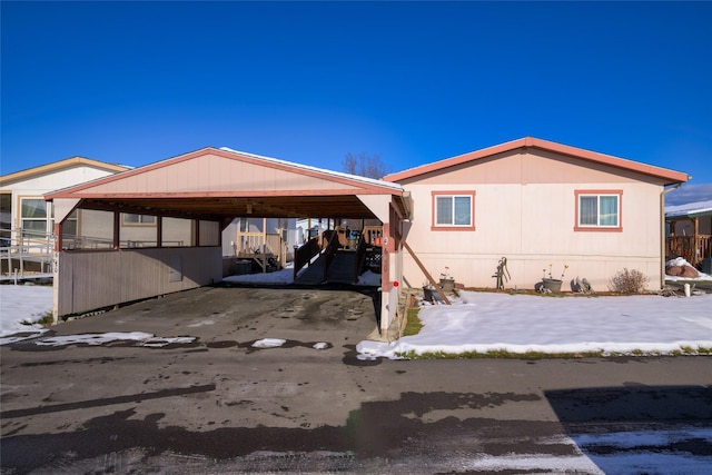 view of home's exterior featuring a carport