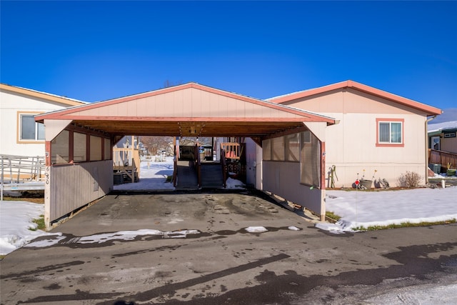 exterior space with a carport