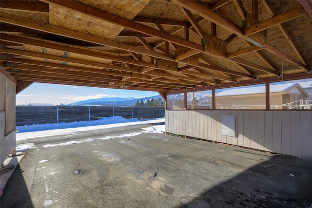 snow covered patio with a mountain view