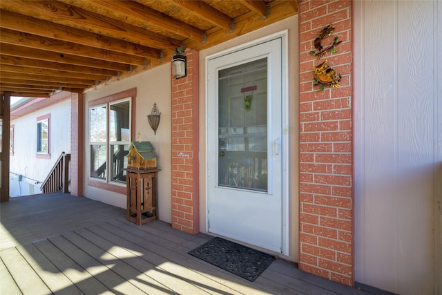 view of exterior entry with covered porch