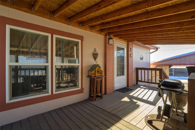 wooden deck featuring area for grilling