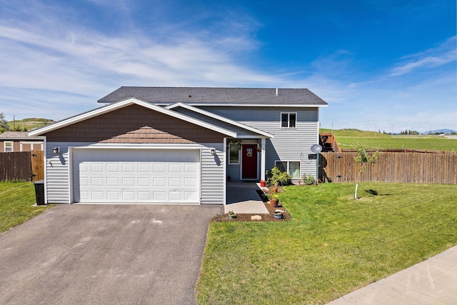 105 Lupine Dr, Kalispell, MT 59901 - view of front of house featuring asphalt driveway and an attached garage