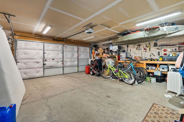 105 Lupine Dr, Kalispell, MT 59901 - garage featuring a garage door opener and a workshop area