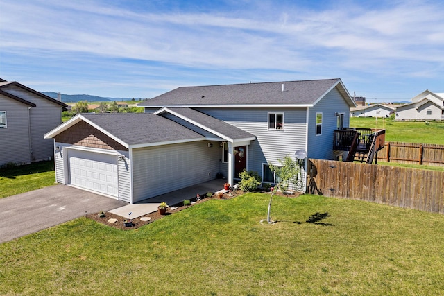 105 Lupine Dr, Kalispell, MT 59901 - view of front facade featuring a garage, driveway, and roof with shingles