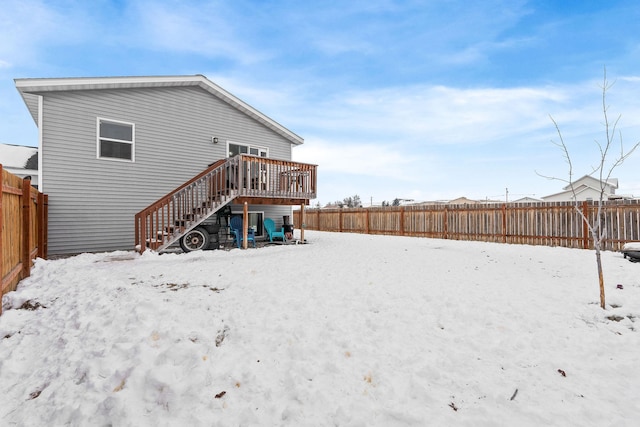 105 Lupine Dr, Kalispell, MT 59901 - snow covered back of property with a wooden deck