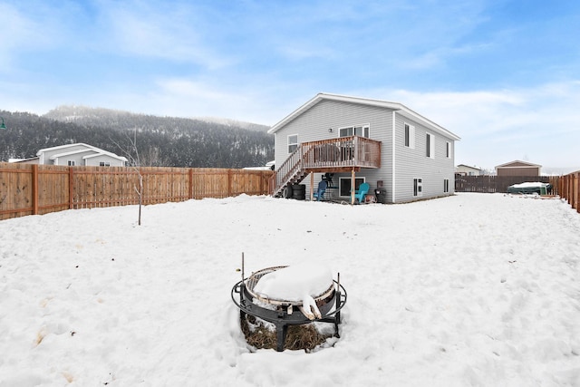 105 Lupine Dr, Kalispell, MT 59901 - snow covered house featuring a deck