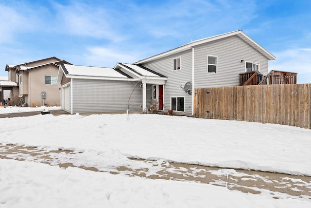 105 Lupine Dr, Kalispell, MT 59901 - snow covered house with a garage