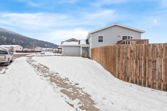 105 Lupine Dr, Kalispell, MT 59901 - snowy yard with a mountain view