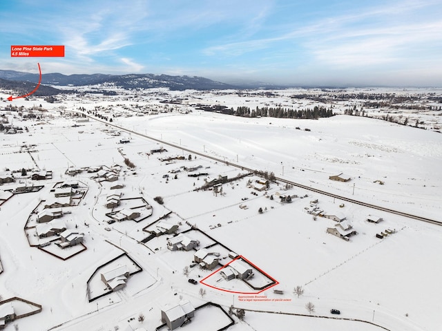 105 Lupine Dr, Kalispell, MT 59901 - snowy aerial view featuring a mountain view