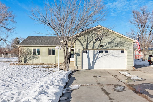 ranch-style home featuring a garage