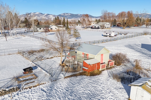 snowy aerial view featuring a mountain view