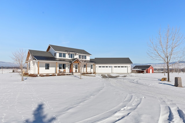 view of front of property featuring a garage and a porch