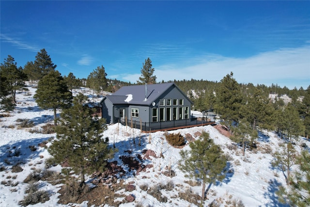 view of snow covered house